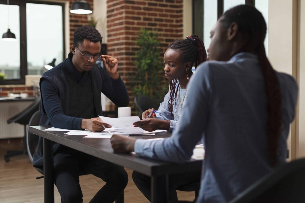 african american research agency coworkers meeting about startup project financial status business people de