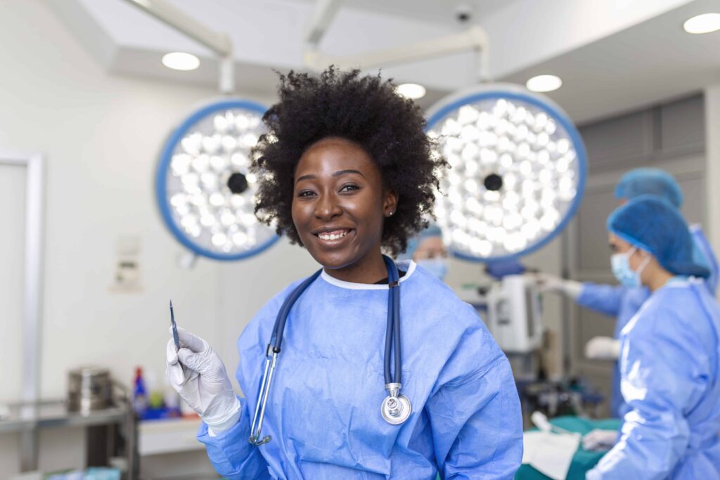 portrait happy african american woman surgeon standing operating room ready work patient female medical